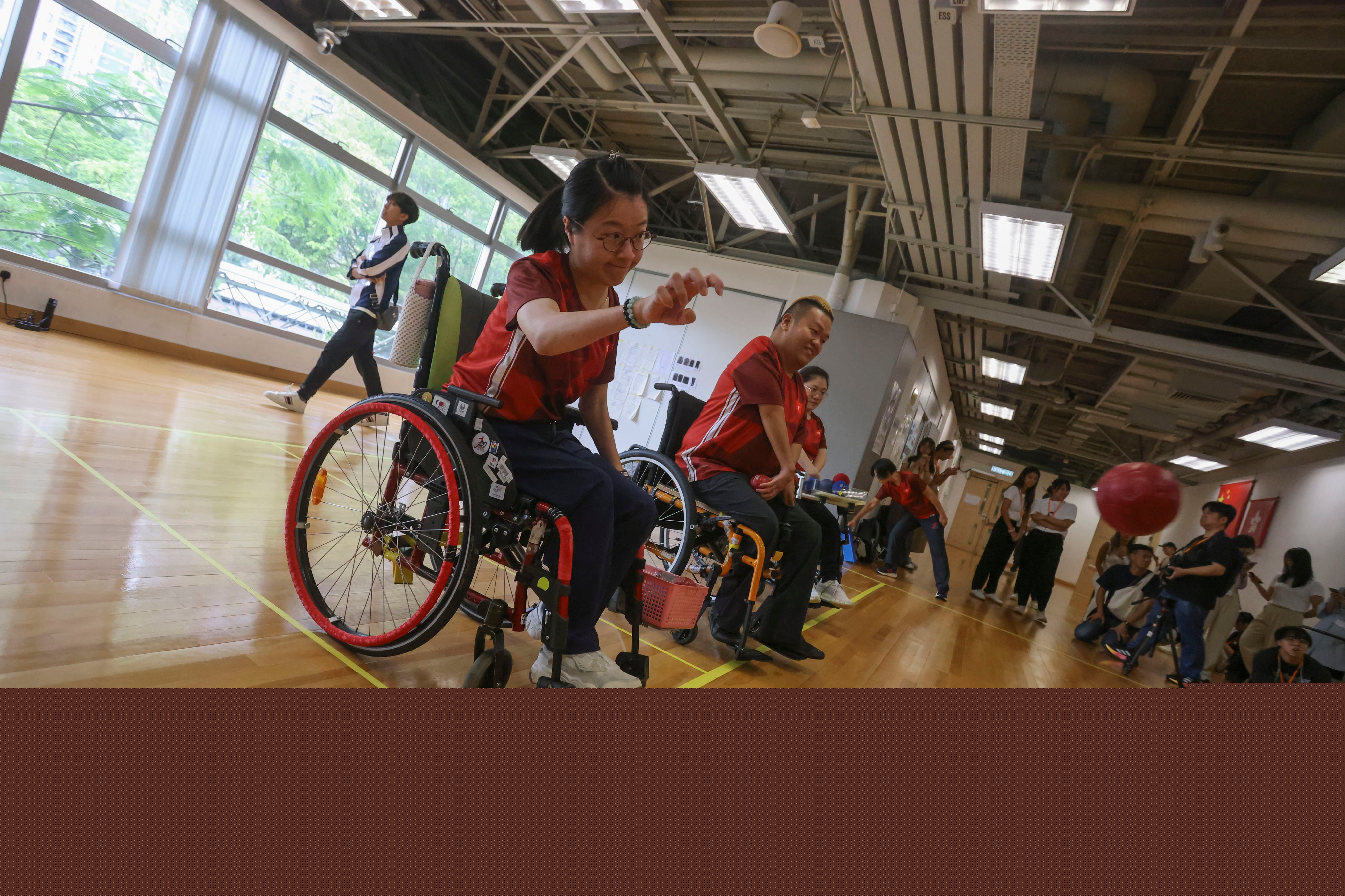 Boccia athletes Yeung Hiu-lam (left) and Leung Yuk-wing demonstrate their skills at Hong Kong Sports Institute ahead of leaving for the Paris Paralympics. Photo: Jonathan Wong