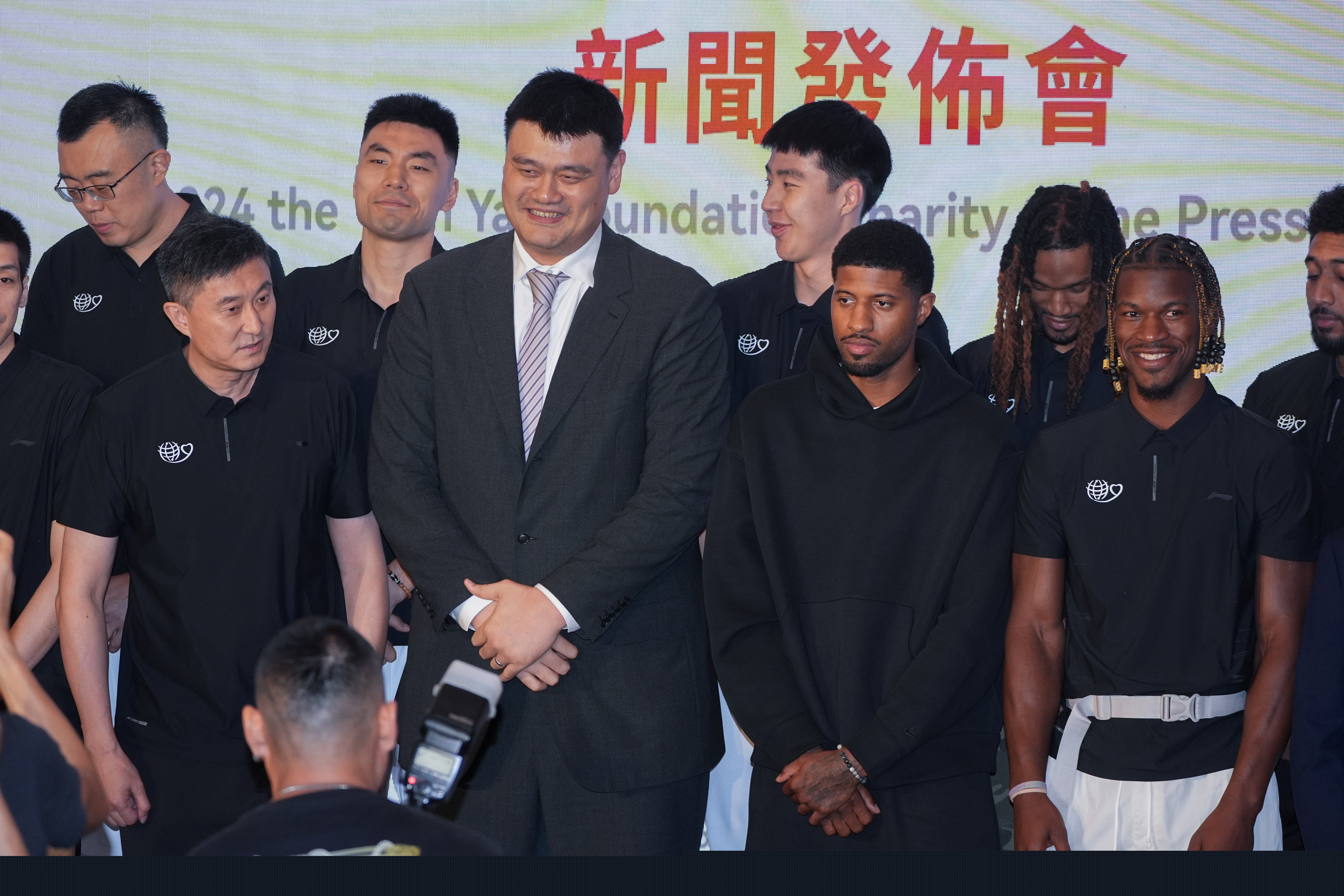Chinese basketball legend Yao Ming, along with NBA stars Paul George and Jimmy Butler, pose for a photo during the 12th Yao Foundation Charity Game press conference at the Peninsula Hotel. Photo: Eugene Lee