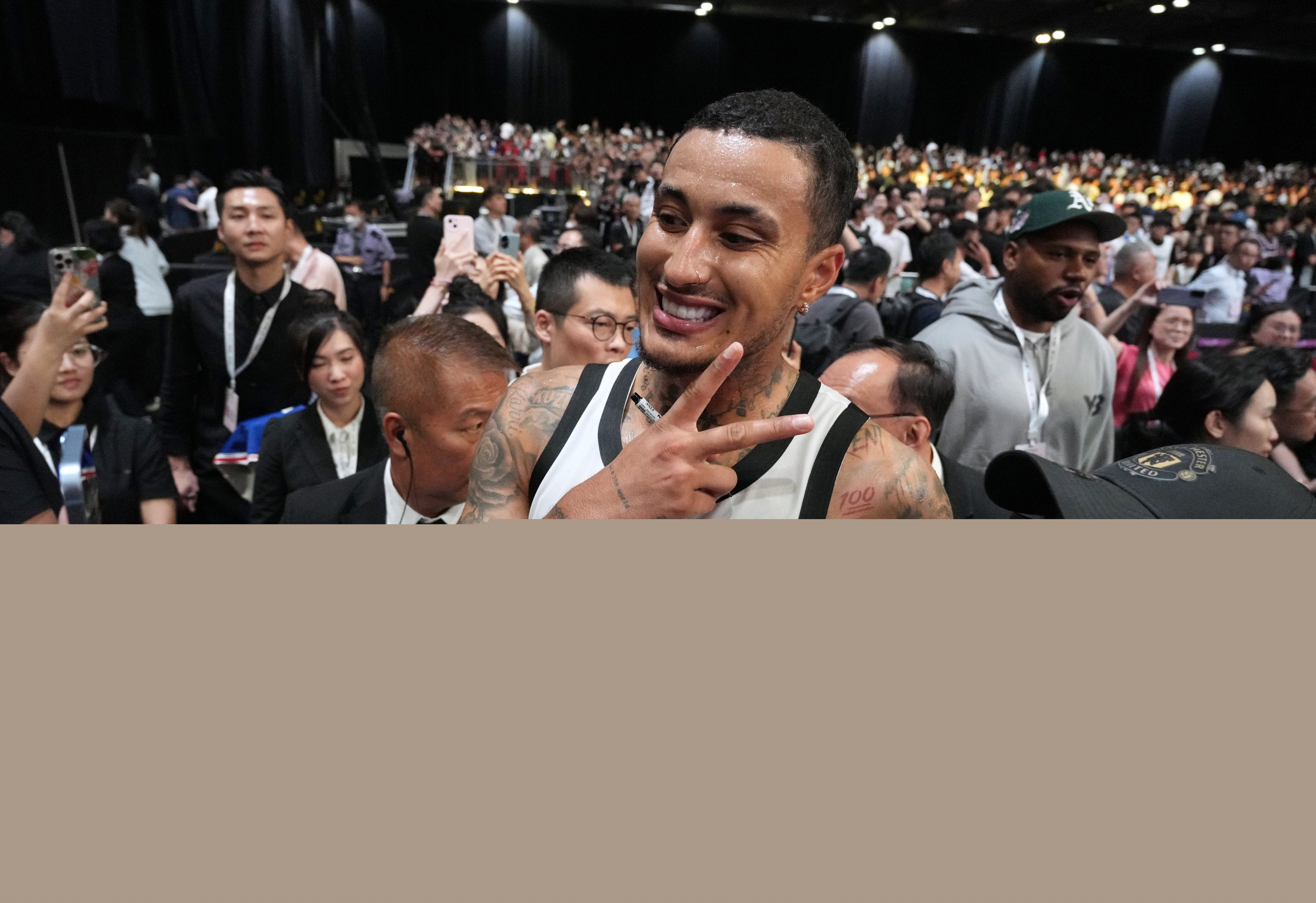 NBA star Kyle Kuzma takes a selfie with a fan at the 12th Yao Foundation Charity Game at Asia World-Expo. Photo: Eugene Lee